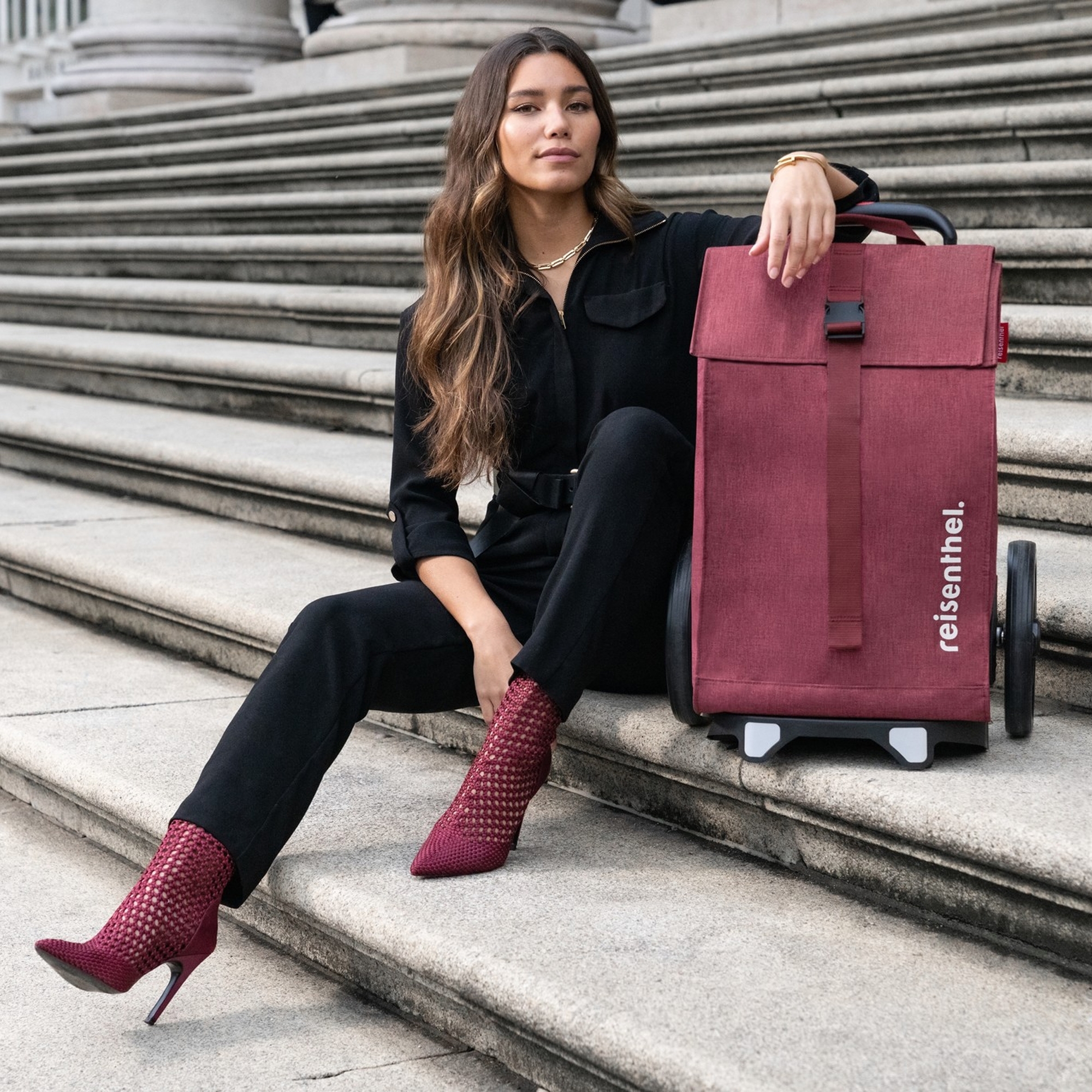 Woman with burgundy Reisenthel shopping trolley