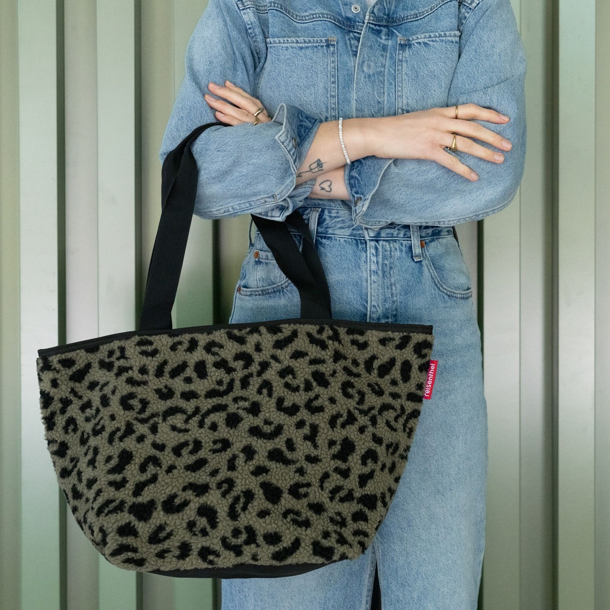 Leopard print teddy bag with black handles