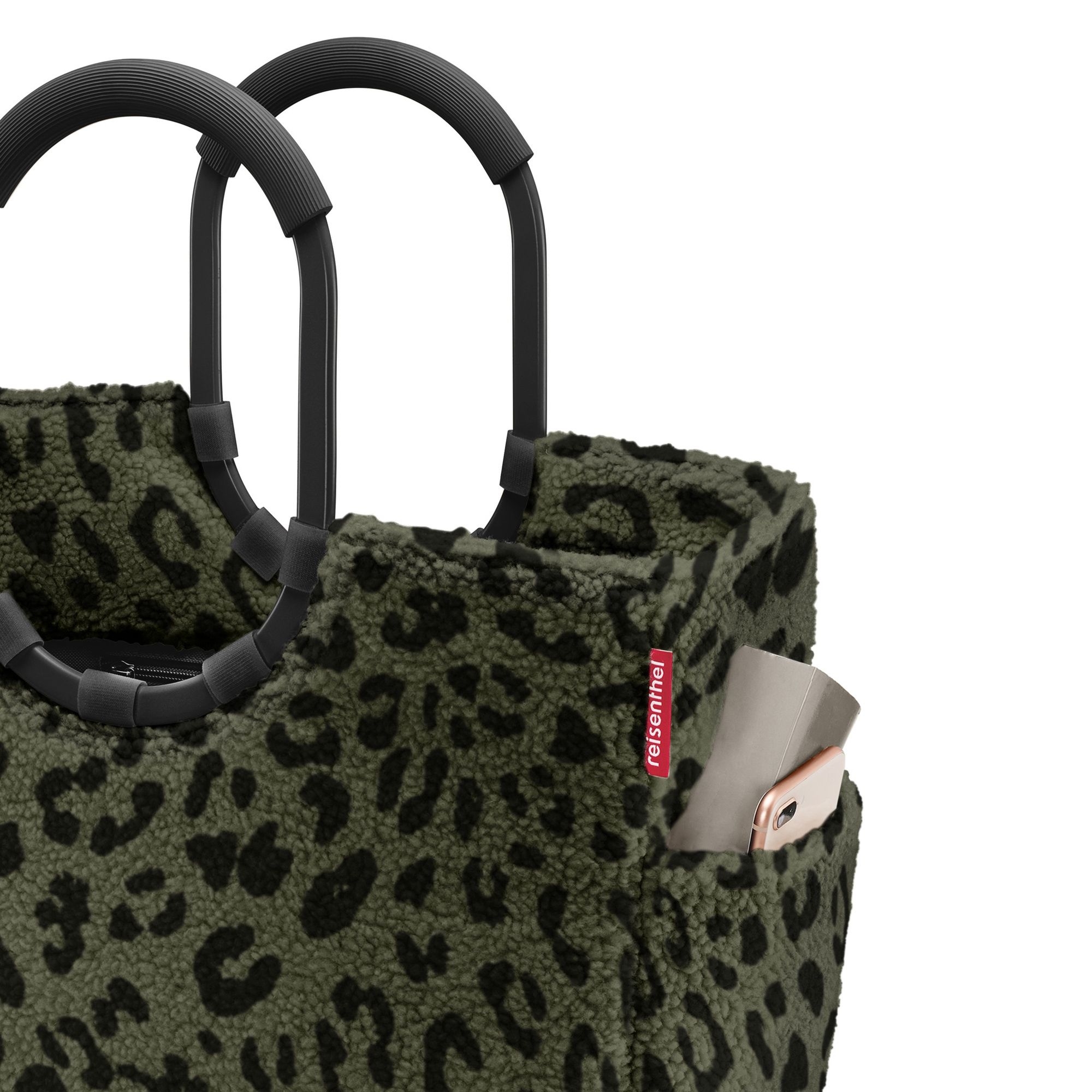 Green bag with leopard print and black handles
