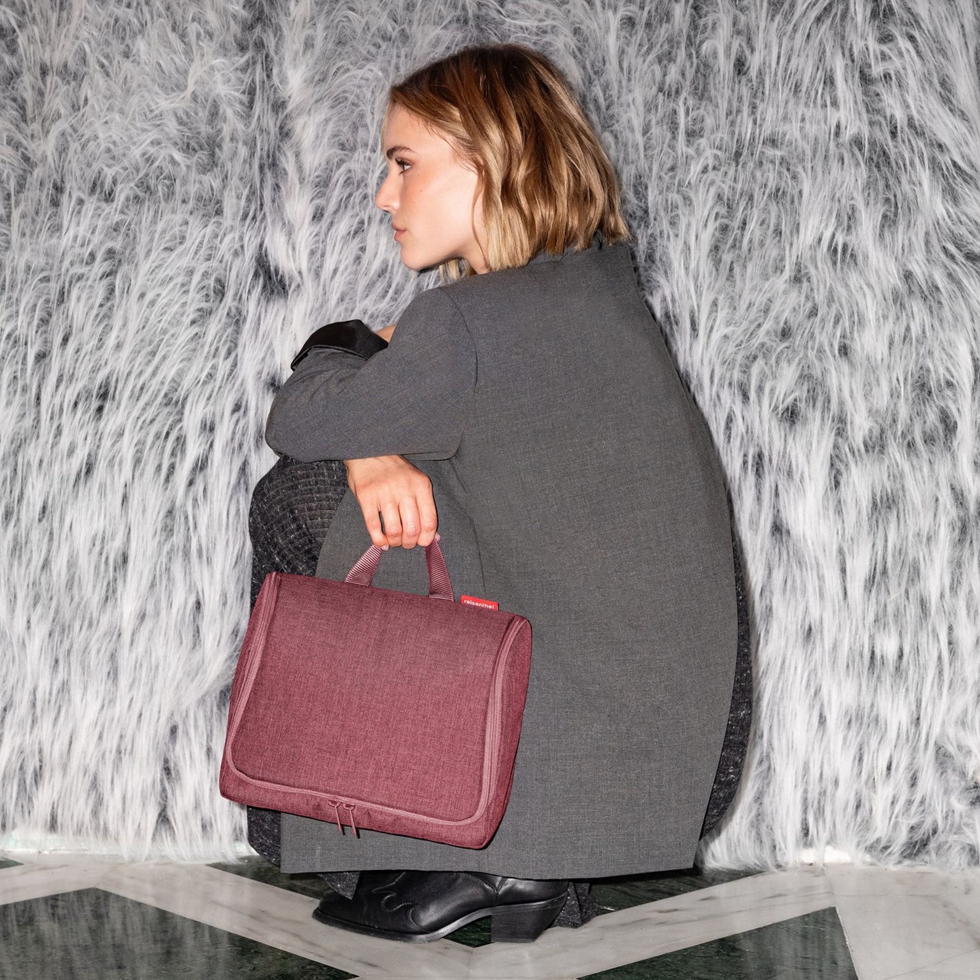 Woman with burgundy business bag in modern style