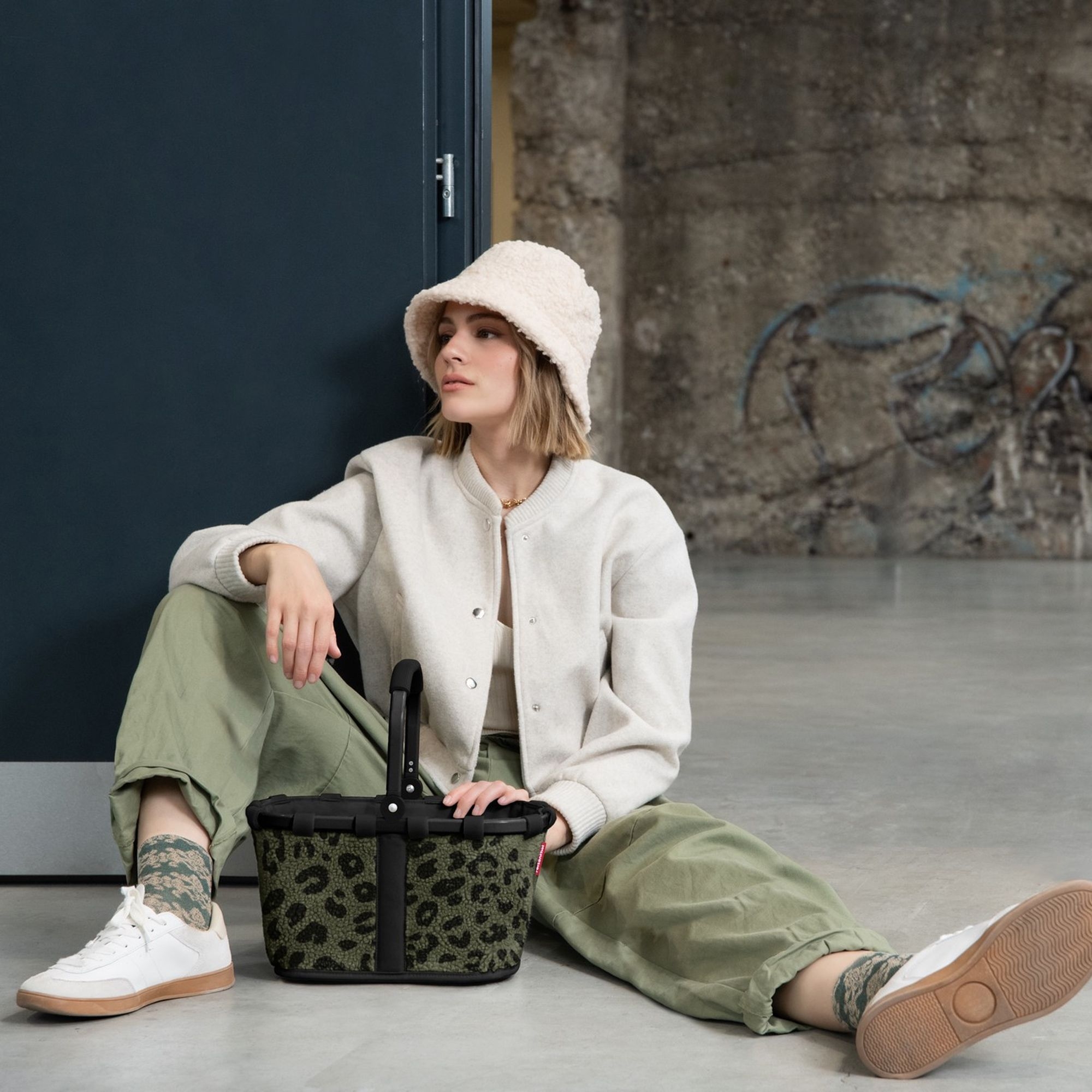Woman with green leopard print shopping basket