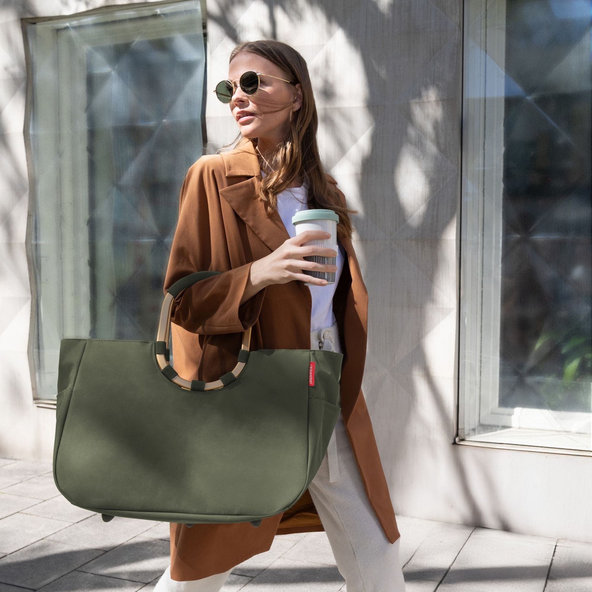 Woman with large olive green shopper bag