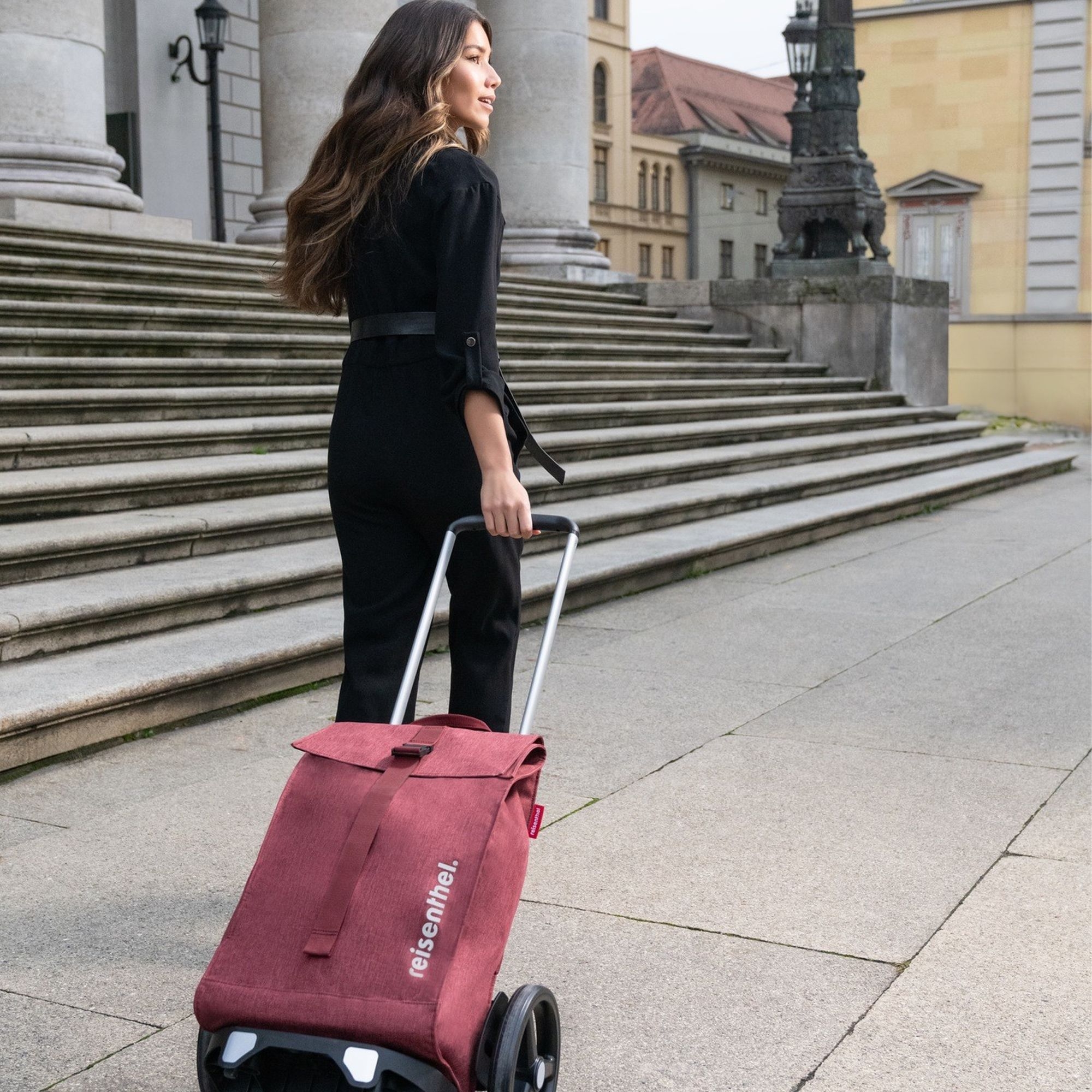 Woman pulling red Reisenthel Trolley M